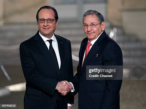 French President Francois Hollande welcomes Cuban President Raul Castro prior to a state dinner at the Elysee Presidential Palace on February 01,...