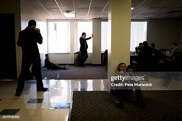 Rand Paul volunteers make calls to potential voters at Paul's Des Moines headquarters on February 1, 2016 in Des Moines, Iowa. Paul volunteers worked...