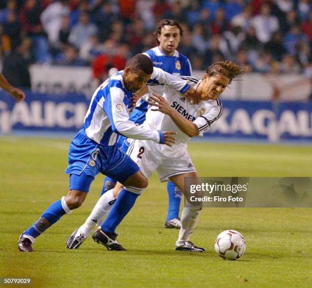 Djalminha of Deportivo and Michel Salgado of Real Madrid fight for the ball during the Spanish Primera Liga match between Deportivo de La Coruna and...