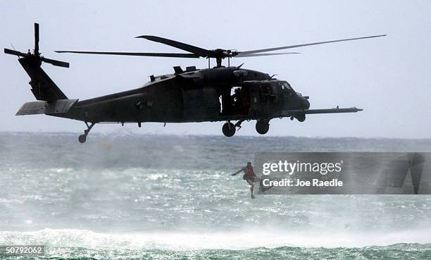 The 920th Rescue Wing performs during their command combat search and rescue show May 1, 2004 during a performance at the 2004 McDonald's Air and Sea...