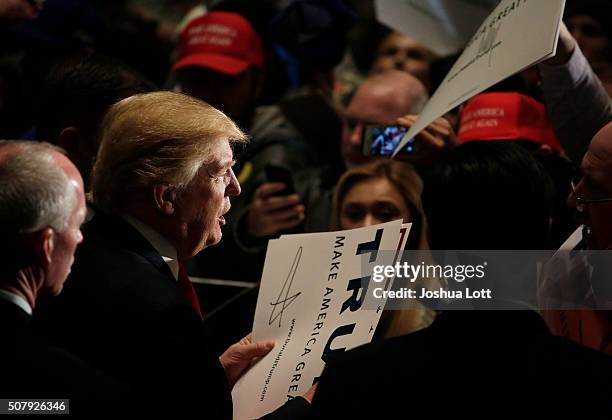 Republican presidential candidate Donald Trump greets people during a campaign event at the U.S. Cellular Convention Center February 1, 2016 in Cedar...