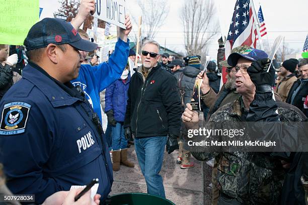 Anti-government protesters shout at law enforcement outside the Harney County Courthouse on February 1, 2016 in Burns, Oregon. Approximately 300...