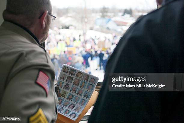 Harney County Sheriff holds a list of possible people to question while looking out the Harney County Courthouse window on February 1, 2016 in Burns,...