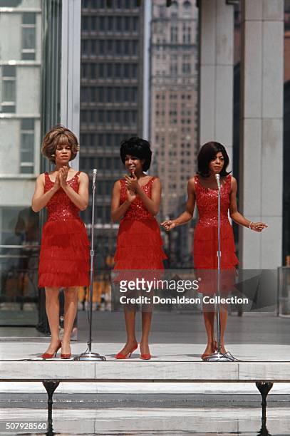 Singers, Mary Wilson, Florence Ballard and Diana Ross of the R and B Group 'The Supremes' perform on a TV show in 1965 in Detroit, Michigan.