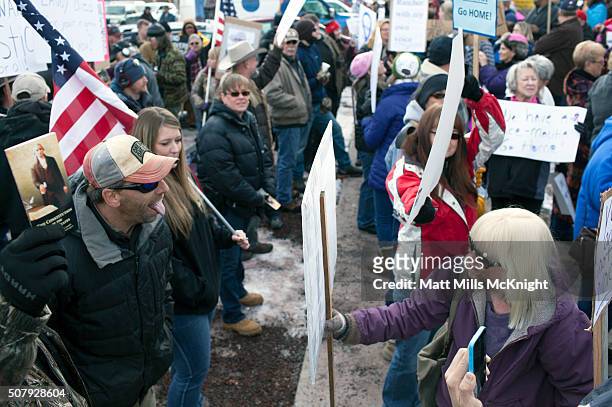 Law enforcement supporters and anti-government protesters argue outside the Harney County Courthouse on February 1, 2016 in Burns, Oregon....