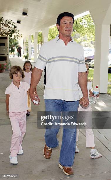 Actor Sylvester Stallone and his daughters attend the 14th Annual Hollywood Charity Horse Show on May 1, 2004 at the Los Angeles Equestrian Center in...