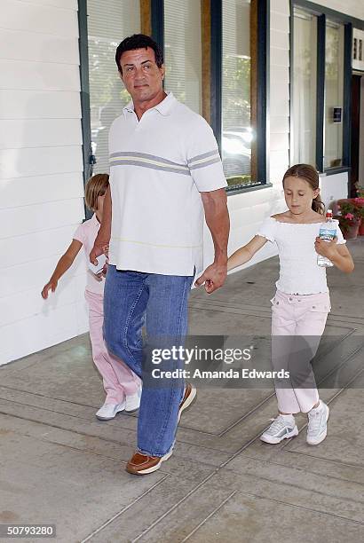 Actor Sylvester Stallone and his daughters attend the 14th Annual Hollywood Charity Horse Show on May 1, 2004 at the Los Angeles Equestrian Center in...