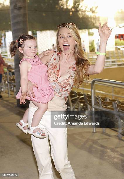 Actress Christine Taylor and her daughter Ella attend the 14th Annual Hollywood Charity Horse Show on May 1, 2004 at the Los Angeles Equestrian...