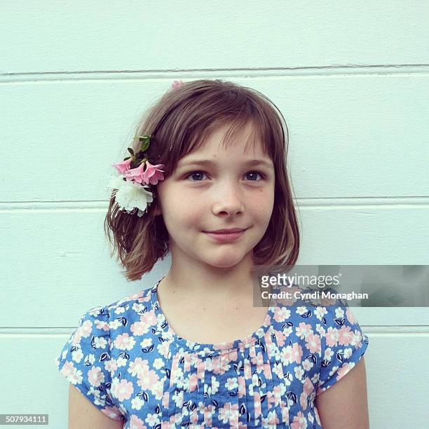 girl with azaleas in her hair - taken on mobile device stock pictures, royalty-free photos & images