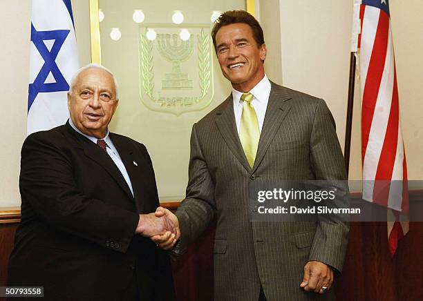 Israeli Prime Minister Ariel Sharon and California Governor Arnold Schwarzenegger shake hands May 2, 2004 at the start of their meeting in Sharon's...