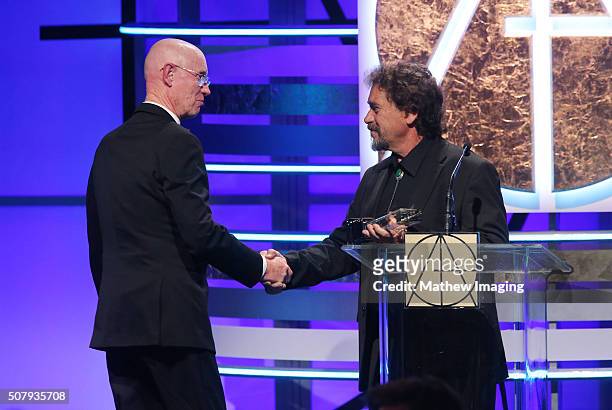 Scenic artist Bill Anderson accepts the Lifetime Achievement award from artist Michael Denering at the 20th Annual Art Directors Guild Excellence In...