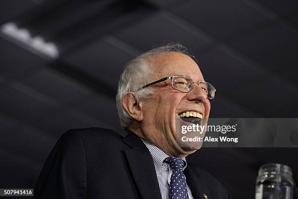 Democratic presidential candidate Sen. Bernie Sanders laughs as he speaks to supporters during a caucus night party February 1, 2016 in Des Moines,...