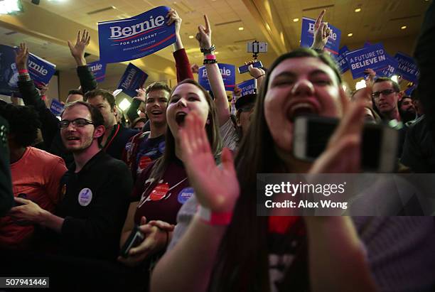 Supporters cheer as they wait for results during Democratic presidential candidate Sen. Bernie Sanders' caucus night party February 1, 2016 in Des...