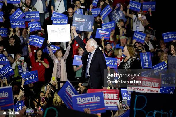 Democratic presidential candidate Bernie Sanders acknowledges the crowd before speaking during his Caucus night event at the at the Holiday Inn...