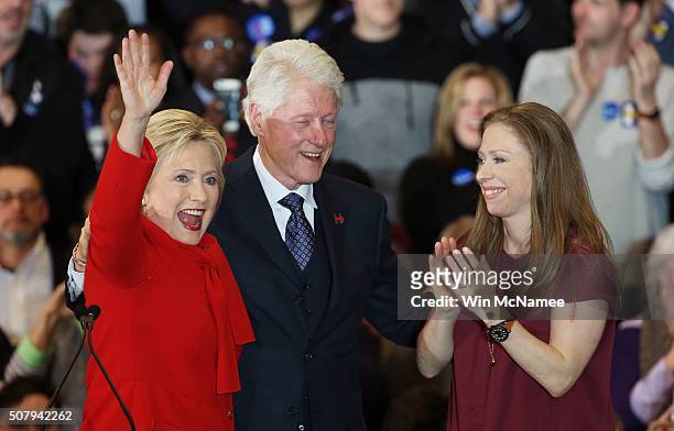 Democratic presidential candidate former Secretary of State Hillary Clinton waves to supporters as Former U.S. President Bill Clinton and daughter...