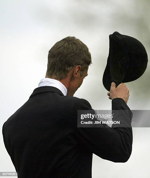 British rider William Fox-Pitt tips his hat to the crowd 02 May 2004 after winning the Mistubishi Motors Badminton Horse Trials at Badminton,...