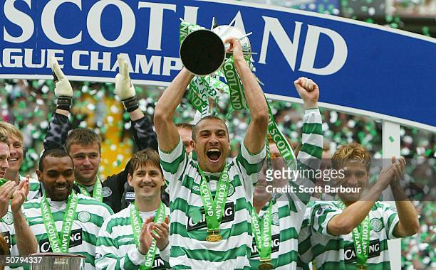 Celtic's Henrik Larsson celebrates with the trophy after the Scottish Premier League match between Glasgow Celtic and Dunfermline Athletic played at...
