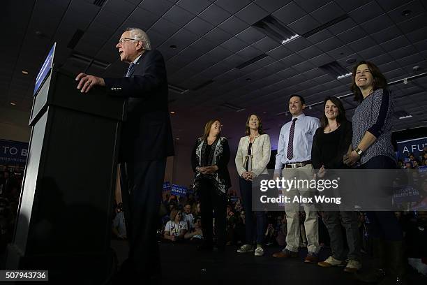 Democratic presidential candidate Sen. Bernie Sanders speaks as his wife Jane O'Meara Sanders and other family members listen during a caucus night...