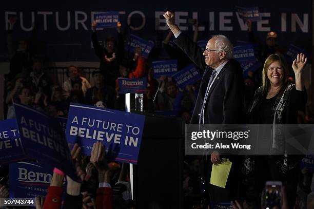 Democratic presidential candidate Sen. Bernie Sanders and his wife Jane O'Meara Sanders acknowledge supporters during a caucus night party February...