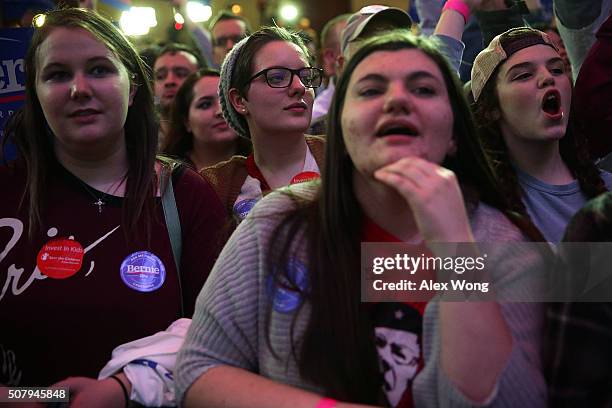 Supporters wait for results during Democratic presidential candidate Sen. Bernie Sanders' caucus night party February 1, 2016 in Des Moines, Iowa....