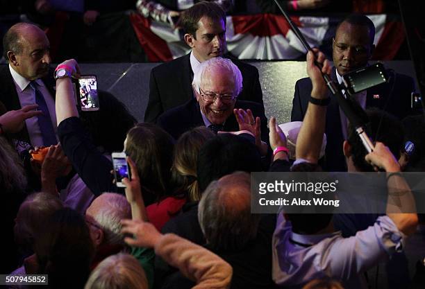 Democratic presidential candidate Sen. Bernie Sanders greets supporters during a caucus night party February 1, 2016 in Des Moines, Iowa.Sanders was...