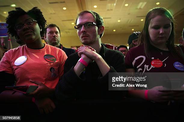 Supporters wait for results during Democratic presidential candidate Sen. Bernie Sanders' caucus night party February 1, 2016 in Des Moines, Iowa....