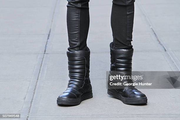 David Granados seen at Industria Superstudios wearing black Topman snow boots and black leather Skingraft pants during New York Fashion Week: Men's...