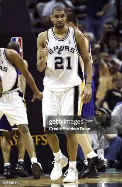 Tim Duncan of the San Antonio Spurs celebrates after making a basket and picking up a foul against the Los Angeles Lakers during game one of the...