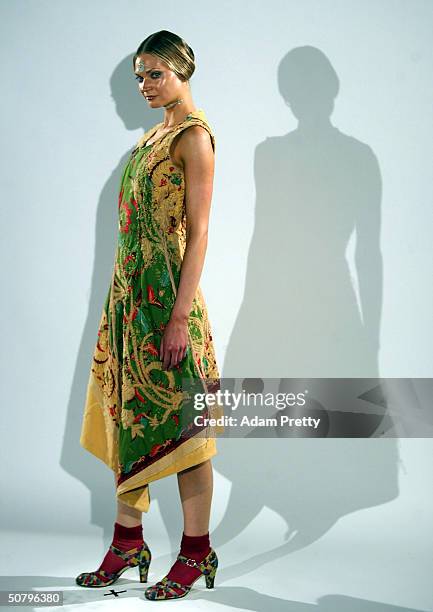 Model walks down the runway during the Akira Collection Show at Mercedes Australian Fashion Week Launch at Sydney University May 3, 2004 in Sydney...