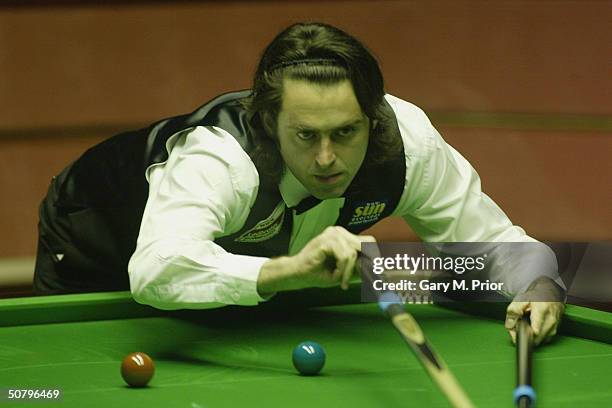 Ronnie O'Sullivan pots another ball during the Embassy World Snooker Final between Ronnie O'Sullivan and Graeme Dott at the Crucible Theatre on May...