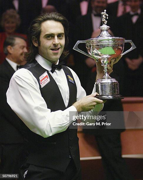 Ronnie O'Sullivan holds aloft the trophy after winning the Embassy World Snooker Final between Ronnie O'Sullivan and Graeme Dott at the Crucible...