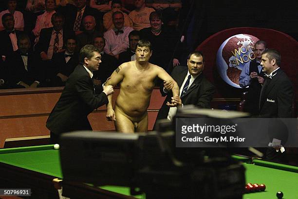 Streaker runs around the table during the Embassy World Snooker Final between Ronnie O'Sullivan and Graeme Dott at the Crucible Theatre on May 3,...