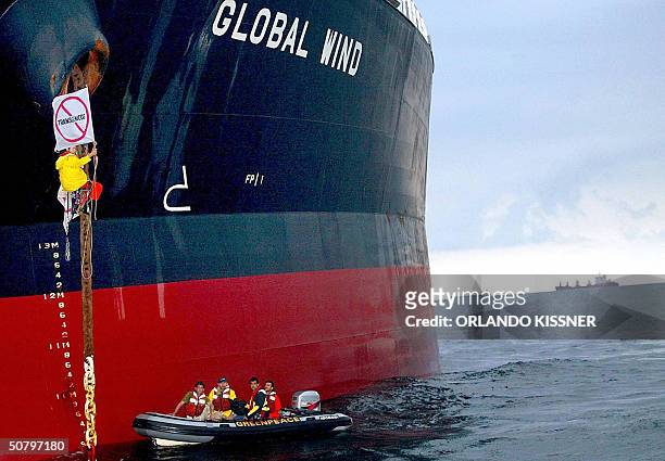 Greenpeace activist attaches himself to the anchor chain of cargo ship Global Wind 03 May, 2004 anchored offshore 40 kms from the port of Paranagua,...