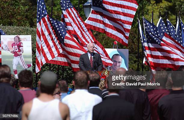 Senator John McCain speaks at a memorial service held by the family of Cpl. Pat Tillman for Tillman, who was killed in action in Afghanistan April 22...