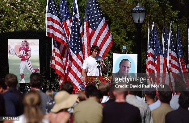 Richard Tillman, the brother of Cpl. Pat Tillman, raises a toast with a glass of Guiness, as he speaks at a memorial service for his Tillman, who was...