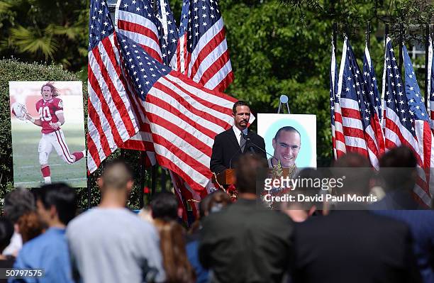 Sports TV and radio host Jim Rome speaks at a memorial service for Cpl. Pat Tillman, who was killed in action in Afghanistan April 22 at the San Jose...
