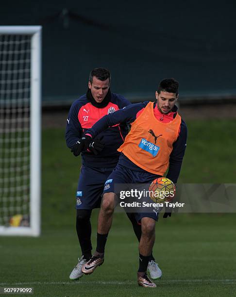 Aleksandar Mitrovic controls the ball whilst being challenged by Steven Taylor during the Newcastle United Training session at The Newcastle United...