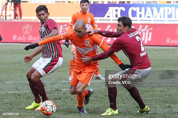 Diego Tardelli of Shandong Luneng is challenged by Mohun Bagan players during the 2016 AFC Champions League qualifying match between Shandong Luneng...