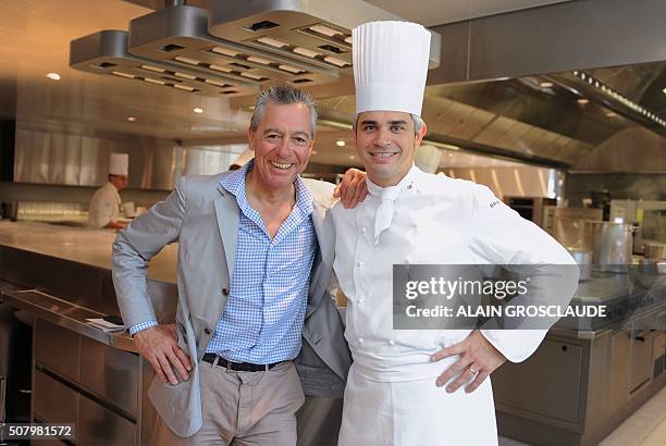 This picture taken on June 3, 2012 shows late top chef Benoit Violier posing with late top chef and mentor Philippe Rochat at the Restaurant de...