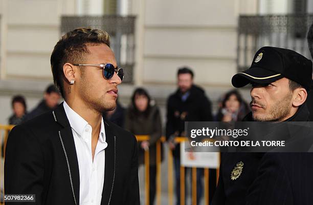 Barcelona's Brazilian forward Neymar arrives to Spain's national court in Madrid on February 2, 2016. Barcelona star Neymar is called to give...