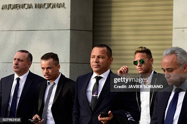 Barcelona's Brazilian forward Neymar and his father Neymar Santos arrive to Spain's national court in Madrid on February 2, 2016. Barcelona star...