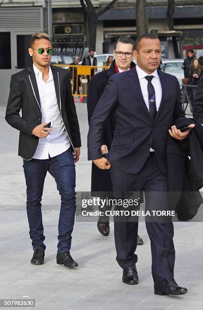 Barcelona's Brazilian forward Neymar and his father Neymar Santos arrive to Spain's national court in Madrid on February 2, 2016. Barcelona star...