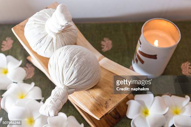 herbal massage ball - massage ball stock pictures, royalty-free photos & images