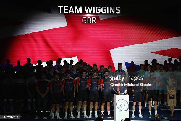 Sir Bradley Wiggins gives the thumbs up as he poses alongside his Wiggins Team during the Presentations at the Westin Hotel ahead of the Tour of...