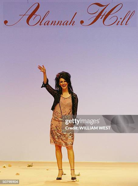 Australian designer Alannah Hill acknowledges the applause after parading her label during Australian Fashion Week, in Sydney 04 May 2004....