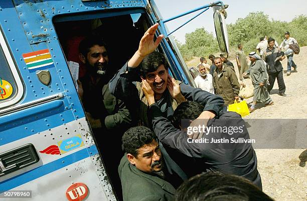Iraqi prisoners from the Abu-Ghraib prison celebrate after being released May 4, 2004 in Tikrit, Iraq. Approximately 200 Iraqi prisoners were...