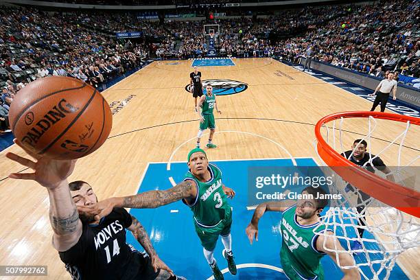 Nikola Pekovic of the Minnesota Timberwolves drives to the basket and shoots the ball against the Dallas Mavericks on January 20, 2016 at the...