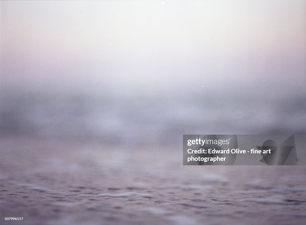 Mediterranean sea water and pink blue sky behind