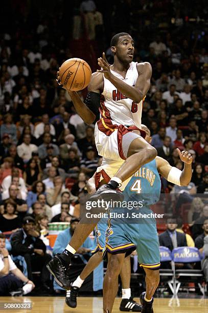 Eddie Jones of the Miami Heat passes against the New Orleans Hornets during Game seven of the Eastern Conference Quarterfinals during the 2004 NBA...