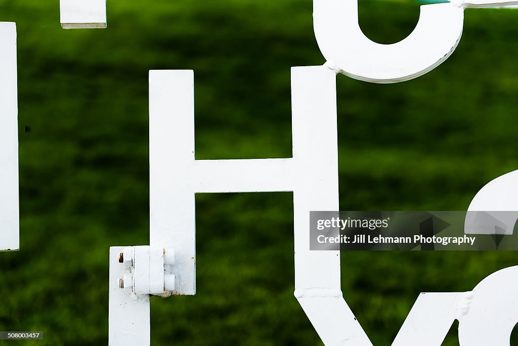 The letter "H" in metal